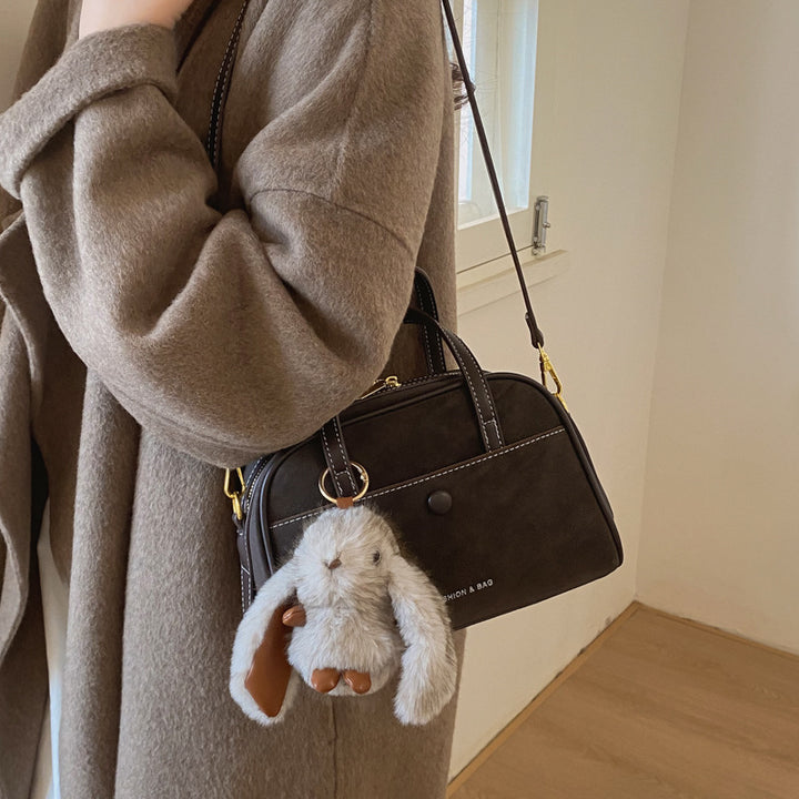 Damen kompakte Handtasche mit verspieltem Tieranhänger Nord Taschen