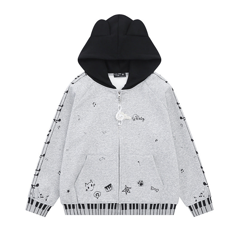 Damen Kapuzensweatjacke mit durchgehendem Reißverschluss, Musikprint, Klaviertasten‑Bündchen und Ohrenkapuze Nord Taschen