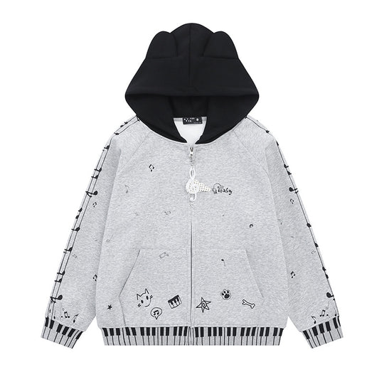 Damen Kapuzensweatjacke mit durchgehendem Reißverschluss, Musikprint, Klaviertasten‑Bündchen und Ohrenkapuze Nord Taschen