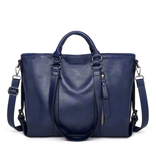 Damen Handtasche aus hochwertigem Kunstleder mit abgepolsterten Tragegriffen und abnehmbarem Schulterriemen Nord Taschen