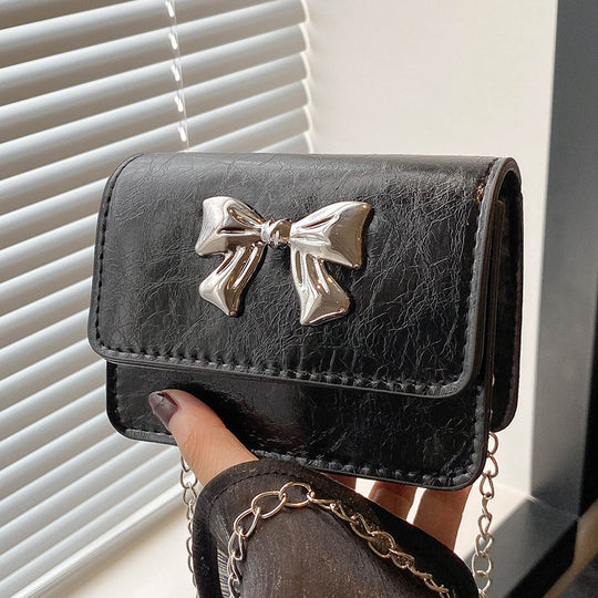 Damen Clutch mit zauberhaftem Schleifendetail und edlem Kettenriemen Nord Taschen