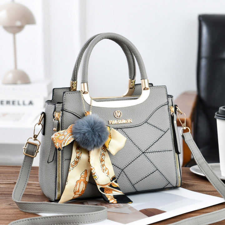 Damen elegante Handtasche mit abnehmbarem Schleifen-Anhänger Nord Taschen