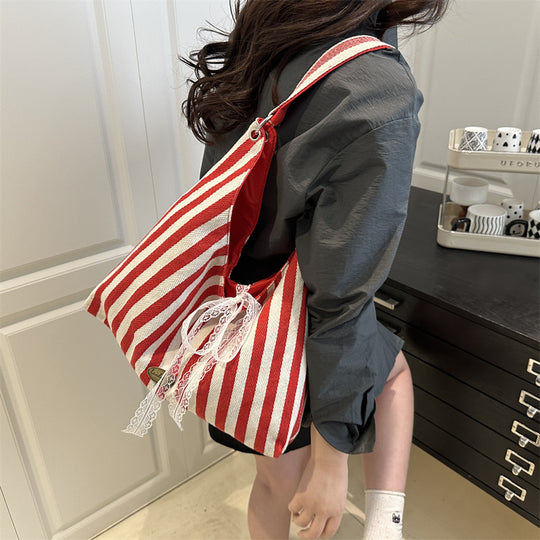 Damen Hobo-Tasche mit modernem Streifenmuster und verspieltem Kordelzug Nord Taschen