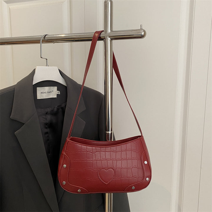 Damen Umhängetasche mit Herzmotiv und strukturierter Oberfläche Nord Taschen