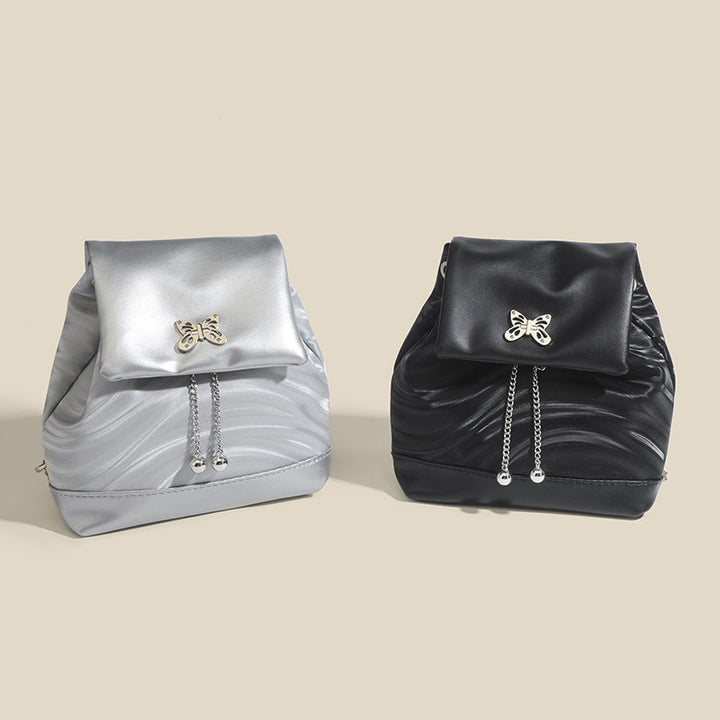 Damen Rucksackhandtasche mit verspieltem Schmetterlingsverschluss und eleganter Oberflächenstruktur Nord Taschen