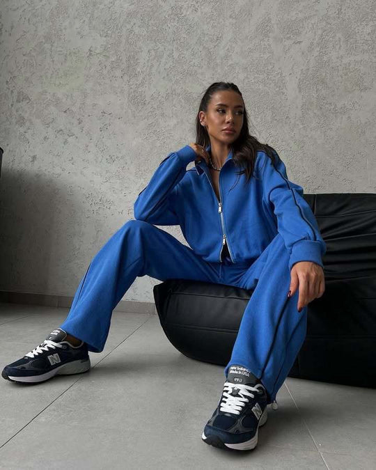 Damen lässiges Sweatset mit Stehkragen Reißverschluss gekürzter Jacke und hochtaillierter Schlaghose Nord Taschen