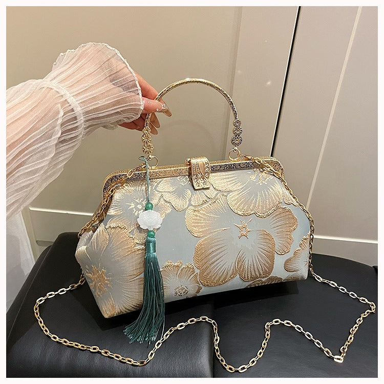 Damen elegante Clutch-Tasche mit floralem Druck und goldenen Akzenten Nord Taschen