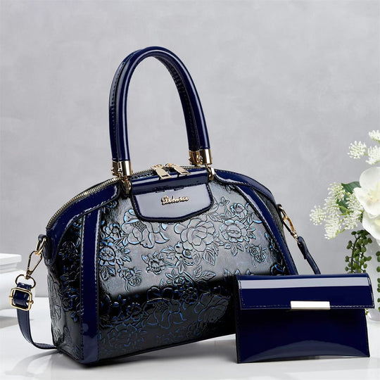 Damen modische Handtasche mit floralen Prägungen und Glanz-Akzenten Nord Taschen