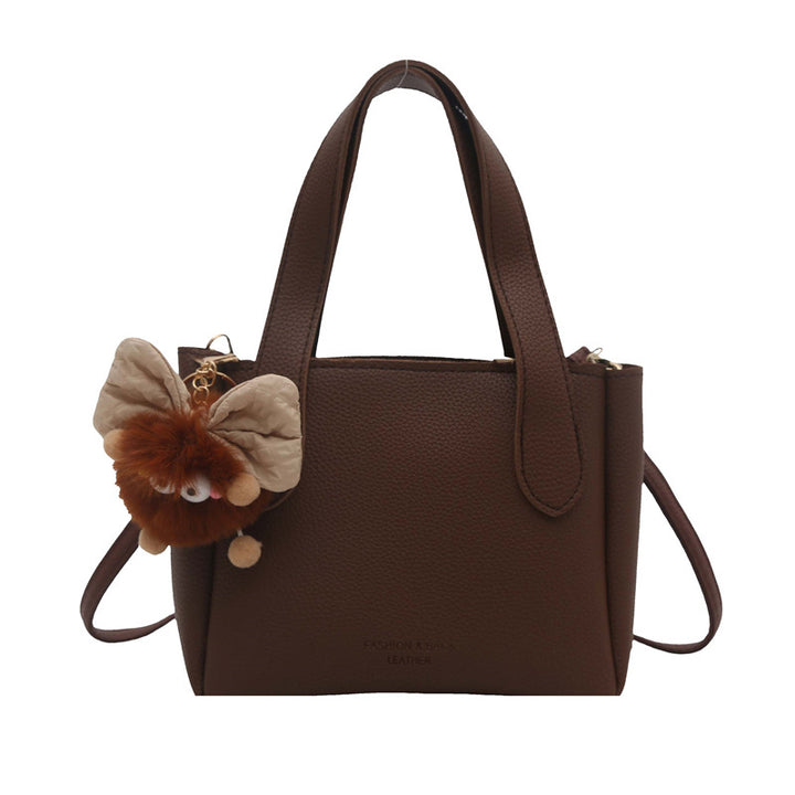 Damen elegante Handtasche mit flauschigem Anhänger Nord Taschen