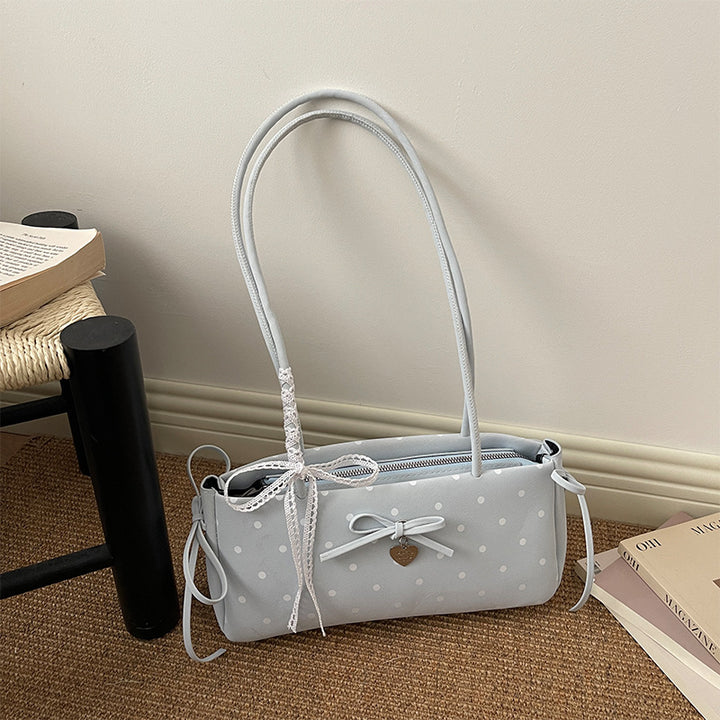 Damen Handtasche mit spielerischem Punktemuster und eleganten Details Nord Taschen