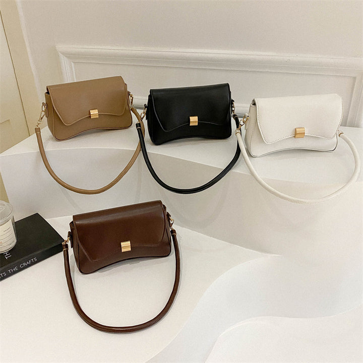 Damen elegante Umhängetasche mit goldener Verschlussmechanik Nord Taschen