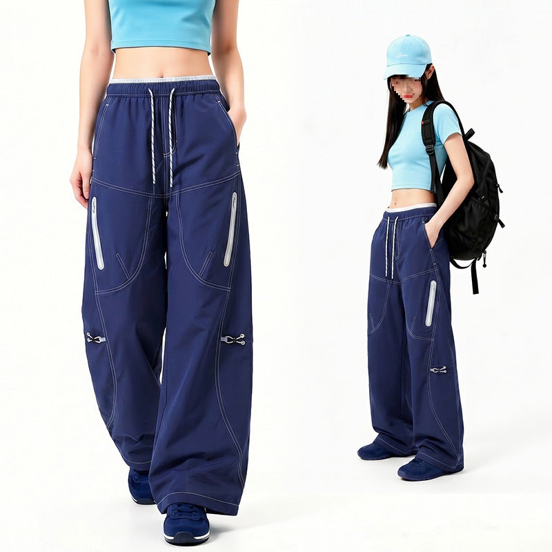 Damen Oversize Tech-Loungehose mit Kontrastnähten, reflektierenden Reißverschlusstaschen & Kordelbund Nord Taschen