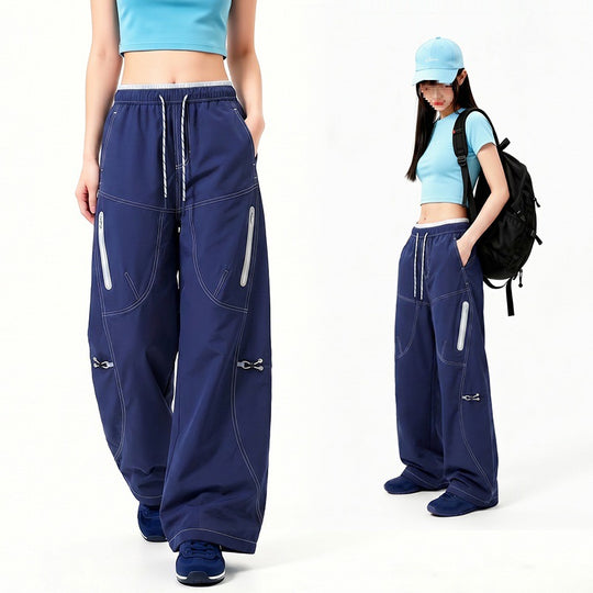 Damen Oversize Tech-Loungehose mit Kontrastnähten, reflektierenden Reißverschlusstaschen & Kordelbund Nord Taschen