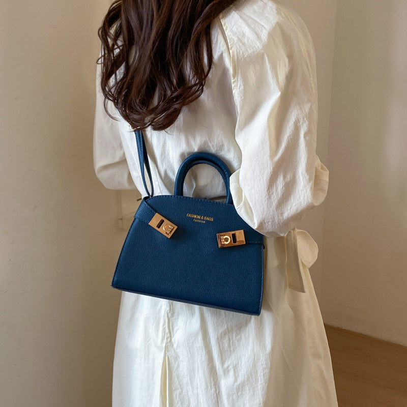 Damen elegante Handtasche mit verspieltem Verschluss Nord Taschen