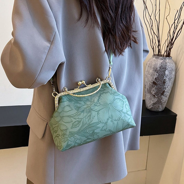 Damen elegante Handtasche mit floralem Relief und goldenen Akzenten Nord Taschen