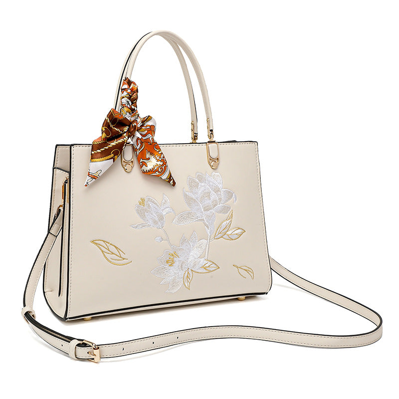 Damen stilvolle Handtasche mit floralem Stickdesign und elegantem Schal Nord Taschen