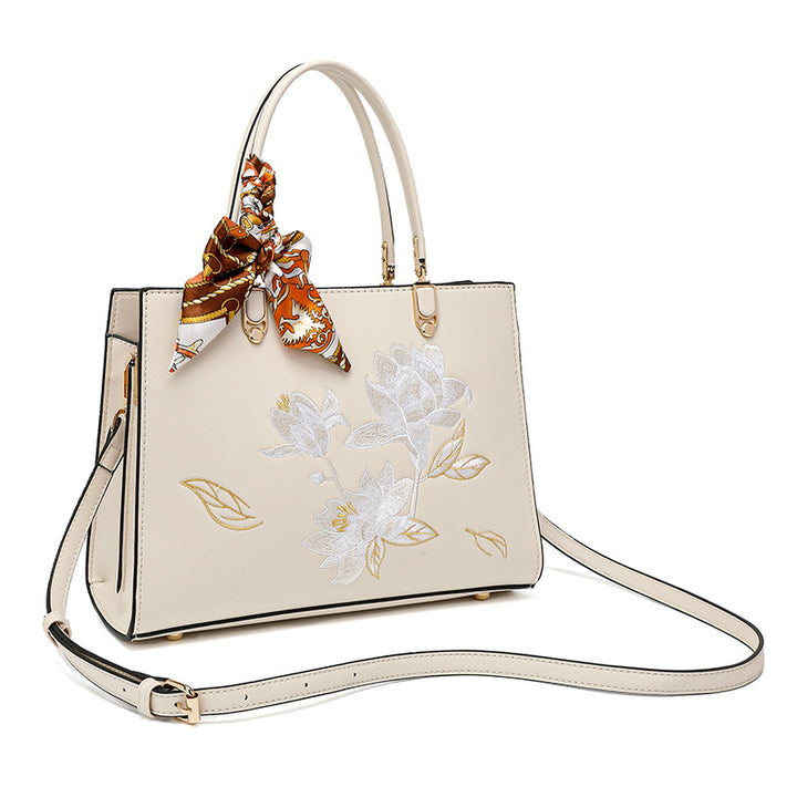 Damen stilvolle Handtasche mit floralem Stickdesign und elegantem Schal Nord Taschen