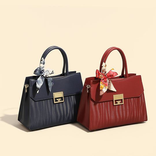 Damen Handtasche mit verstellbarem Schulterriemen und elegantem Schleifenakzent Nord Taschen