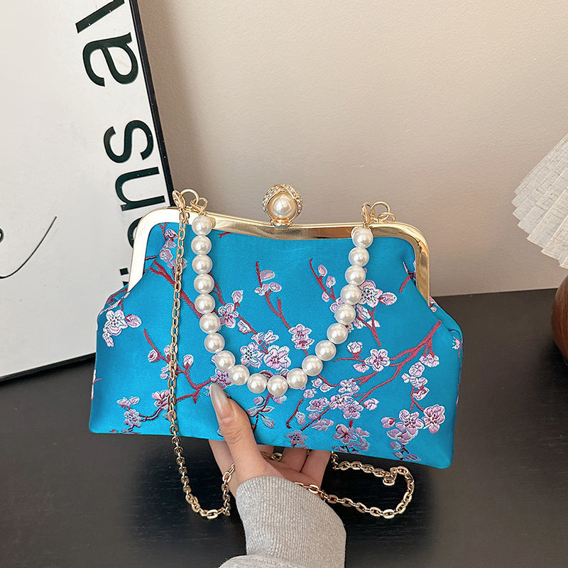 Damen elegante Clutch mit floralen Akzenten Nord Taschen
