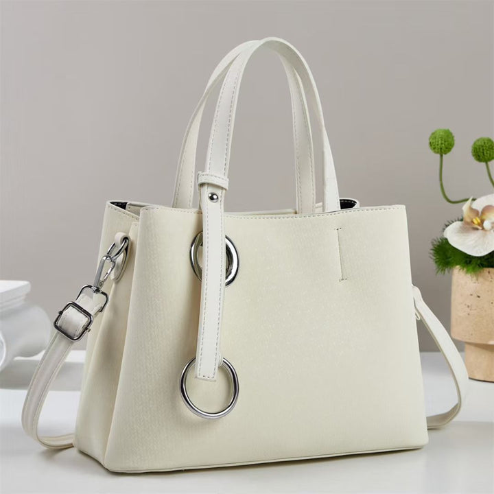 Damen Handtasche mit strukturiertem Design und eleganten Ringdetails Nord Taschen
