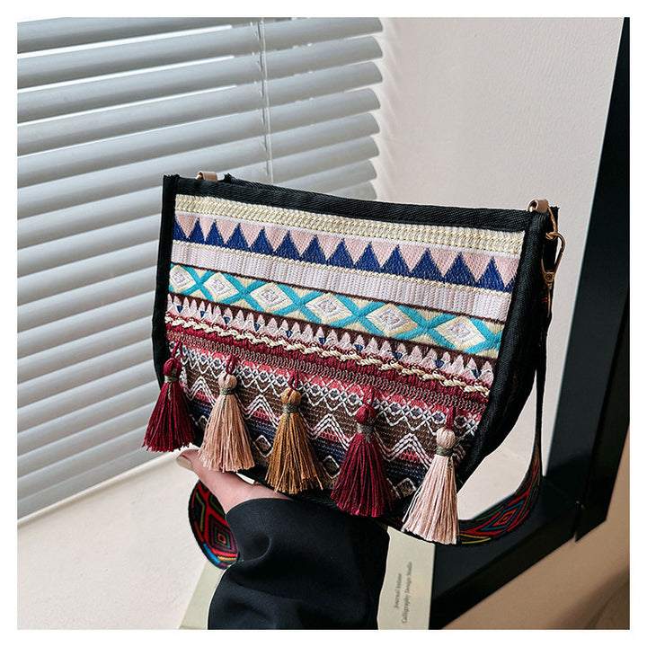 Damen umhängetasche mit kreativem Stickmuster und Quasten Nord Taschen