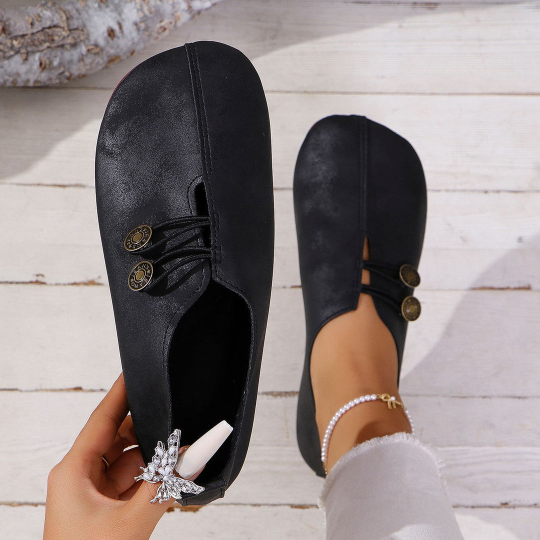 Damen  flache Slipper-Pantoletten aus Wildlederoptik mit elastischer Schnürung und dekorativem Zierknopf Nord Taschen