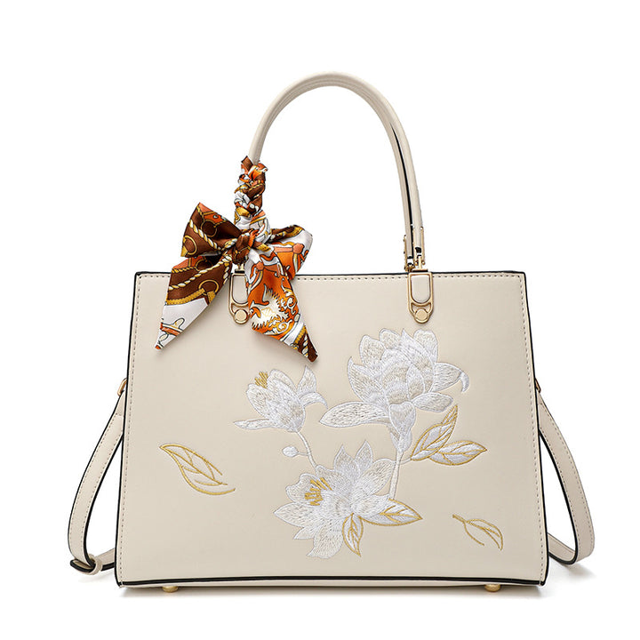 Damen stilvolle Handtasche mit floralem Stickdesign und elegantem Schal Nord Taschen