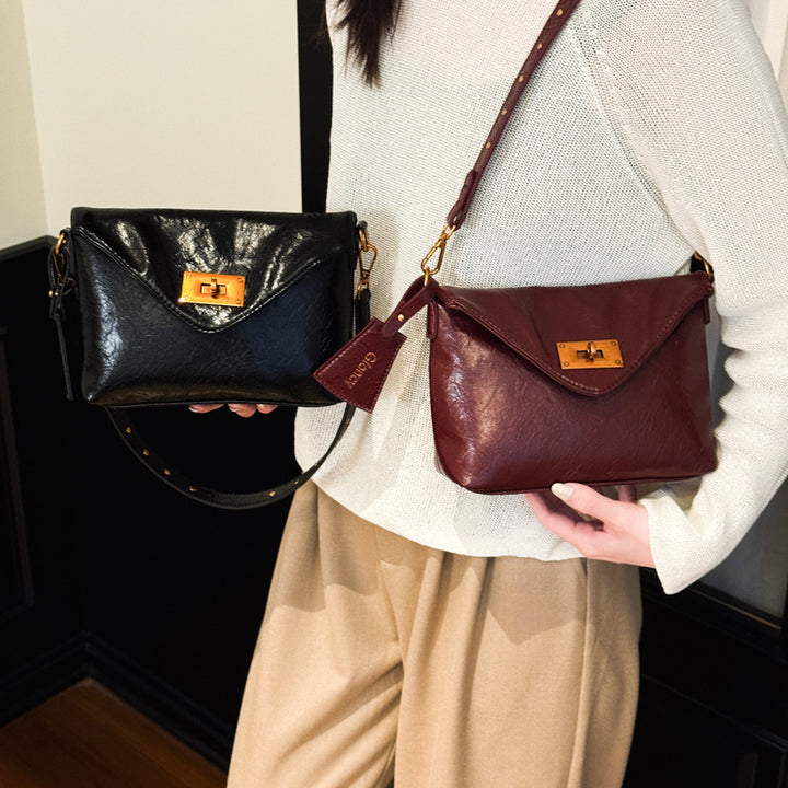 Damen Umhängetasche mit strukturierter Oberfläche und elegantem Drehverschluss Nord Taschen