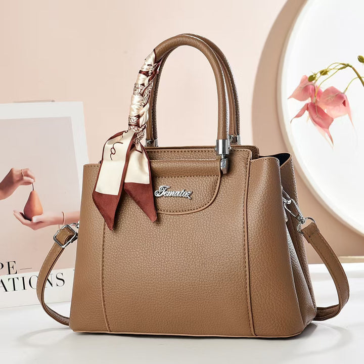Damen Handtasche mit strukturiertem Kunstleder und stilvollem Schal Nord Taschen