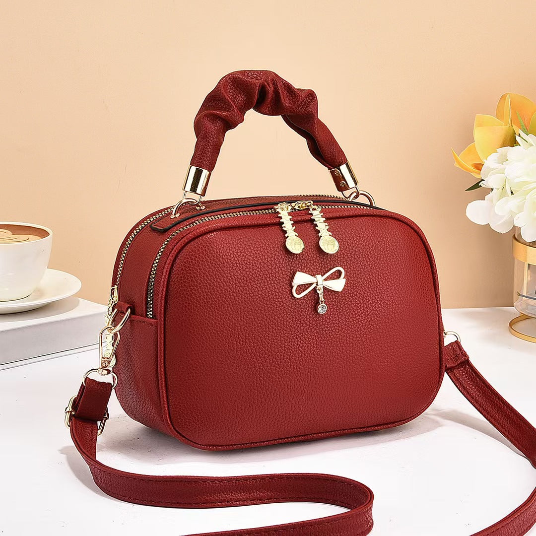 Damen Handtasche mit geflochtenem Tragegriff und edlem Zipper Nord Taschen