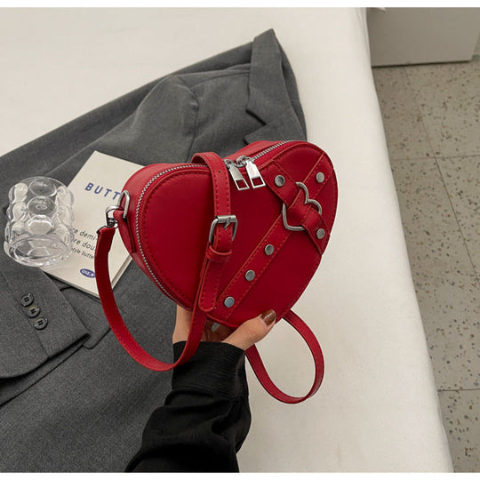 Nord Taschen | Umhängetasche für Damen - Herzförmige Crossbody-Tasche im auffälligen Design mit Riemenverschluss