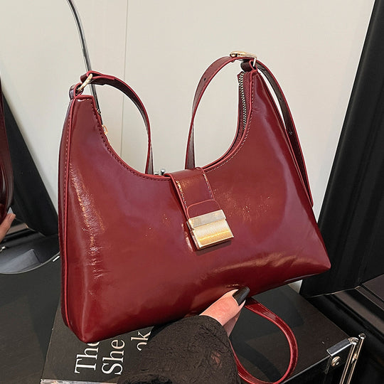 Damen elegante Handtasche mit glänzendem Obermaterial und innovativem Verschluss Nord Taschen
