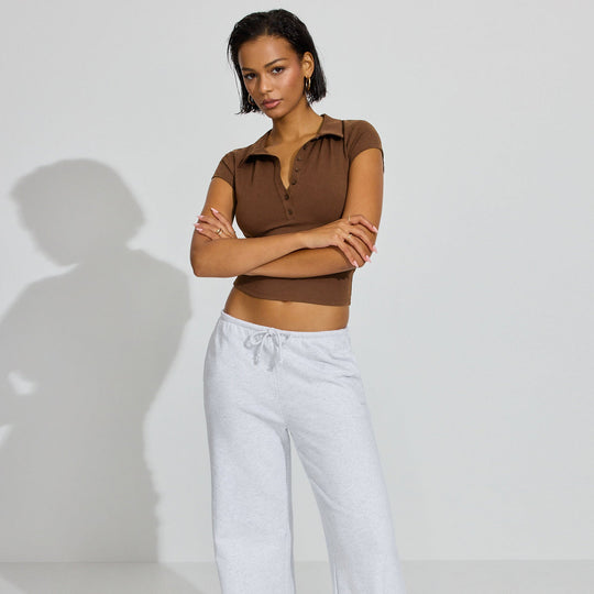 Damen Polo-Shirt mit kurzem Schnitt und modischer Knopfleiste