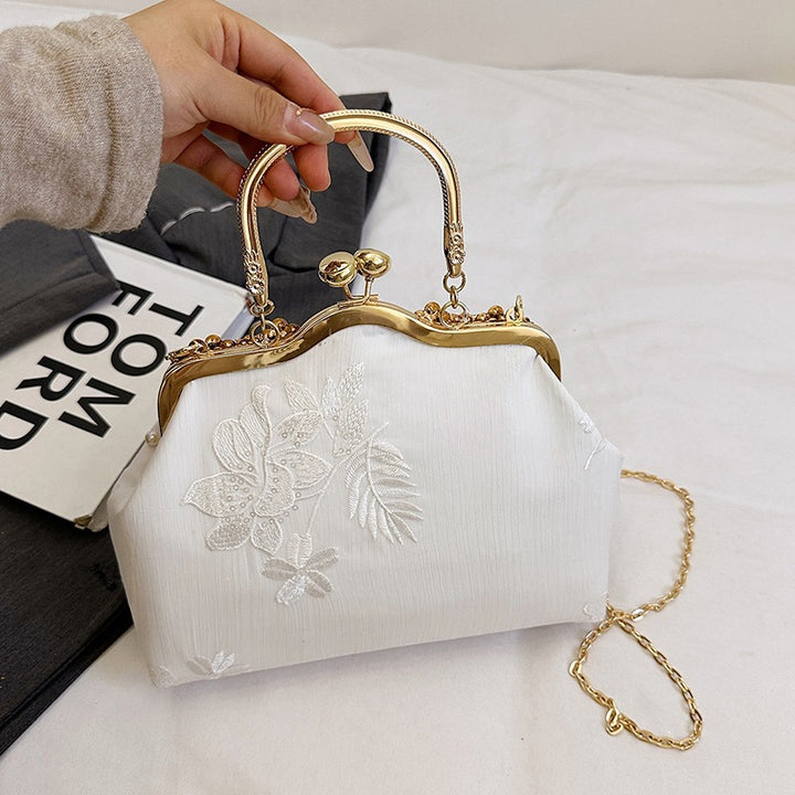 Damen elegante Handtasche mit perlenverziertem Design und Metallakzenten Nord Taschen