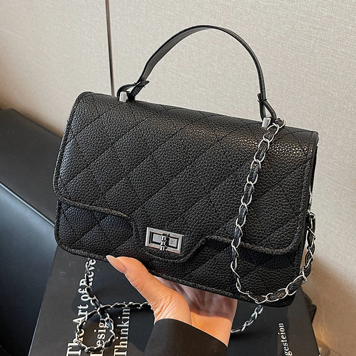 Damen Handtasche mit eleganter Steppung und schickem Metallverschluss Nord Taschen