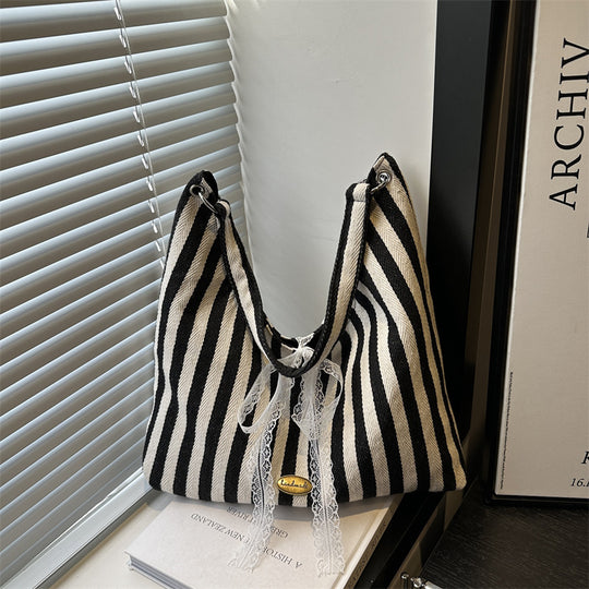 Damen Hobo-Tasche mit modernem Streifenmuster und verspieltem Kordelzug Nord Taschen