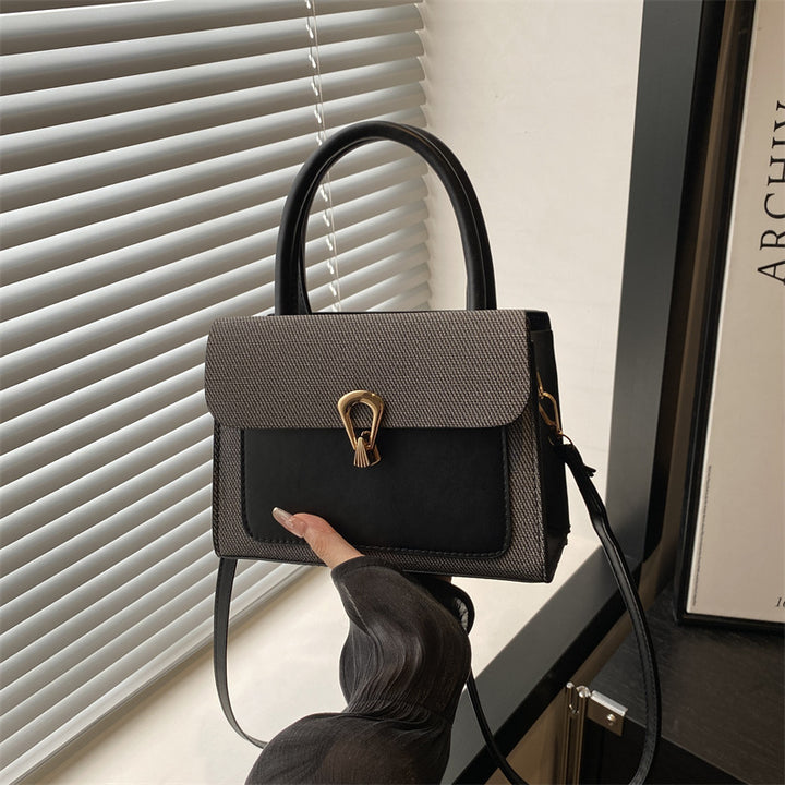 Damen elegante Umhängetasche mit strukturiertem Obermaterial und goldfarbener Verschlussmechanik Nord Taschen