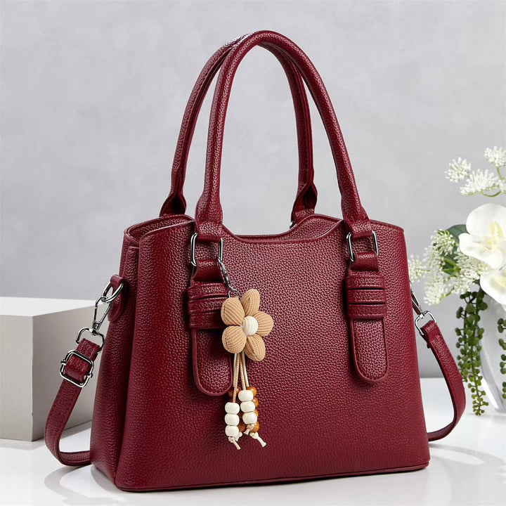 Damen elegante Handtasche mit verspieltem Anhänger Nord Taschen