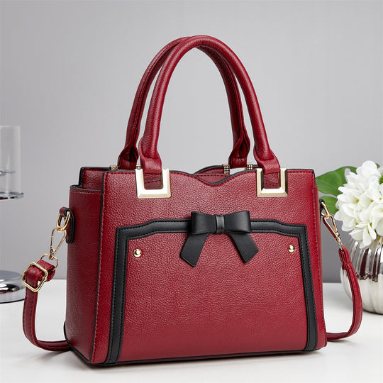 Damen elegante Handtasche mit schimmerndem Schleifendetail und abnehmbarem Schulterriemen Nord Taschen