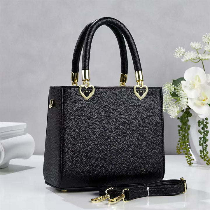 Damen stylische Handtasche mit schimmernden Herzanhängern Nord Taschen