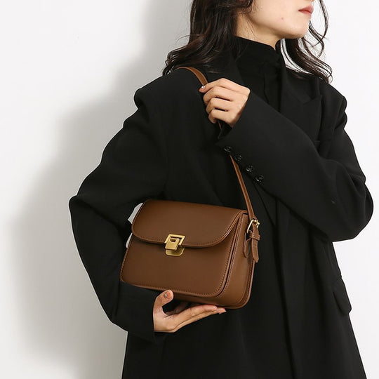 Damen elegante Umhängetasche aus hochwertigem Kunstleder mit stilvollem Verschluss Nord Taschen