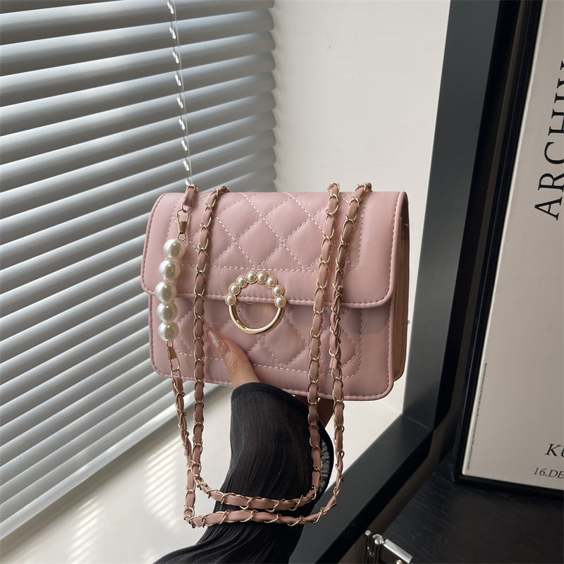 Damen elegante Handtasche mit strukturiertem Design und femininen Perlenakzenten Nord Taschen