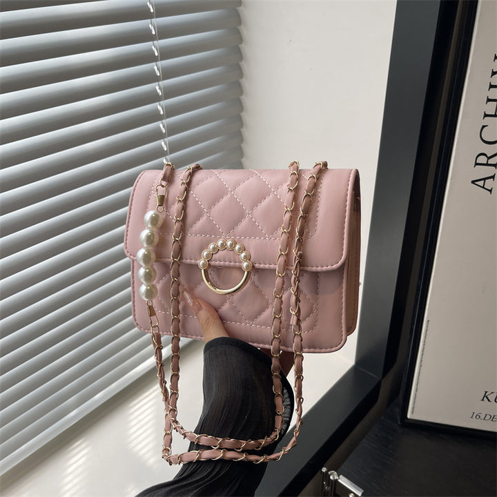 Damen elegante Handtasche mit strukturiertem Design und femininen Perlenakzenten Nord Taschen