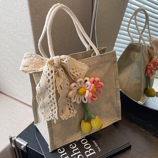 Damen Jute-Strandtasche mit floralem Dekor und verspieltem Schleifenakzent Nord Taschen