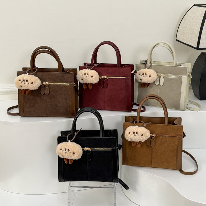Damen stilvolle Handtasche mit charmantem Schlüsselanhänger Nord Taschen
