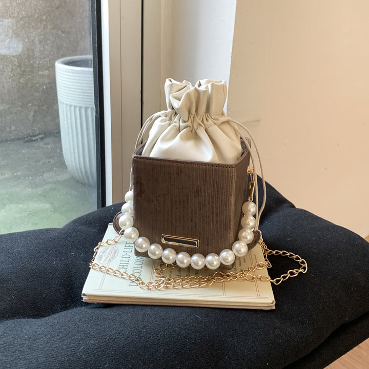 Damen stilvolle Mini-Handtasche mit Kordelzug und Perlenakzent Nord Taschen