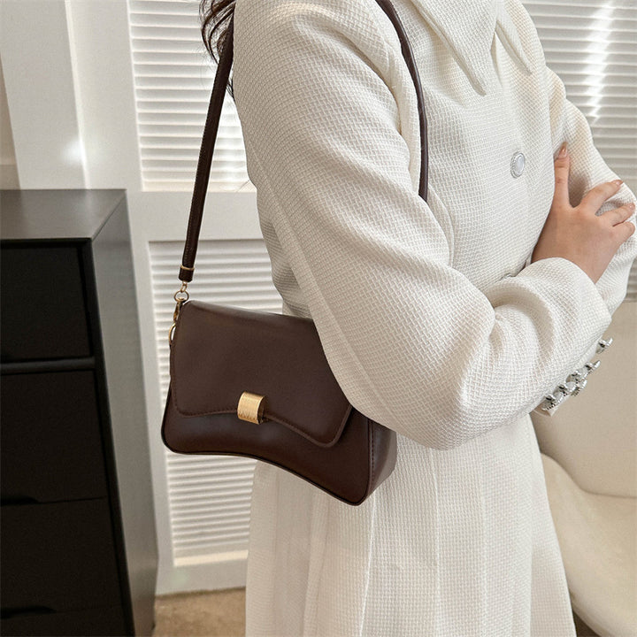 Damen elegante Umhängetasche mit goldener Verschlussmechanik Nord Taschen