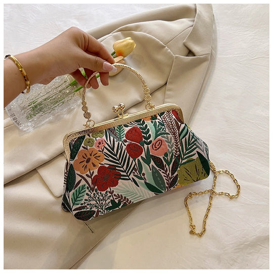 Damen Clutch-Tasche mit floralem Design und goldenen Akzenten Nord Taschen