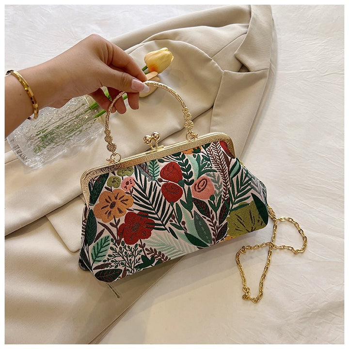 Damen Clutch-Tasche mit floralem Design und goldenen Akzenten Nord Taschen