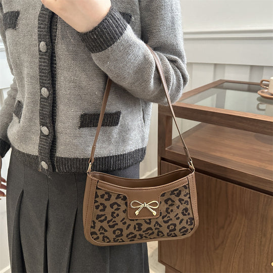 Damen Umhängetasche mit Leopardenmuster und elegantem Kettenriemen Nord Taschen